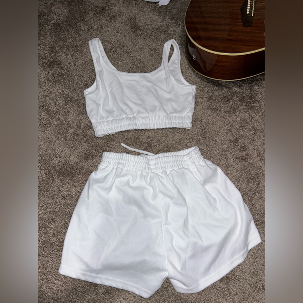 matching white set shorts and cropped tank. size small.